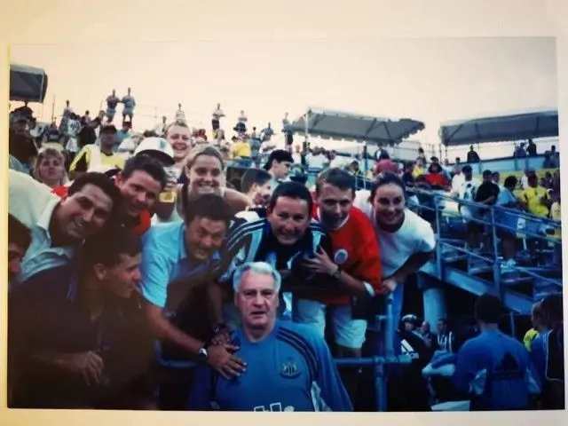 Newcastle fans pictured with Bobby Robson on a pre-season tour