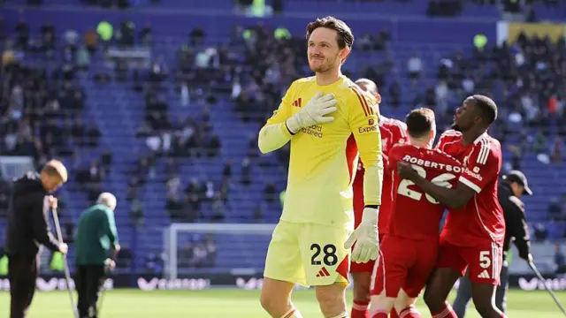 Freddie Woodman of Liverpool gestures to the away support
