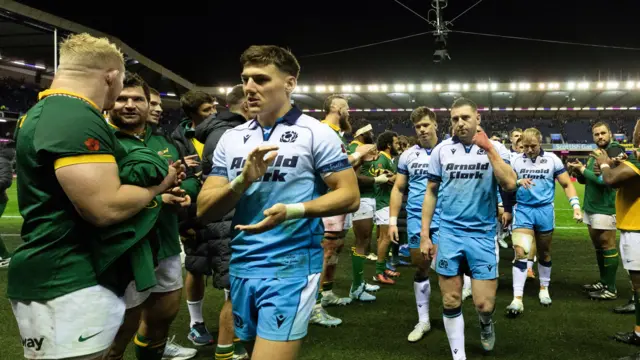 Scotland players are clapped off by South Africa at the end of the Test match
