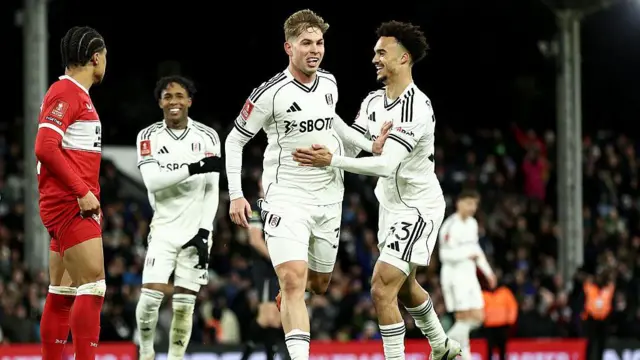 Emile Smith Rowe of Fulham celebrates scoring his team's second goal against Middlesborough with teammate Antonee Robinson