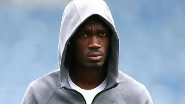 Yves Bissouma wears a Tottenham hoodie before a match