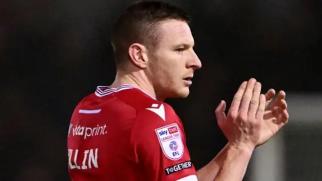 Wrexham striker Paul Mullin applauds