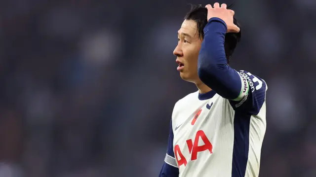 Son Heung-min stands dejected