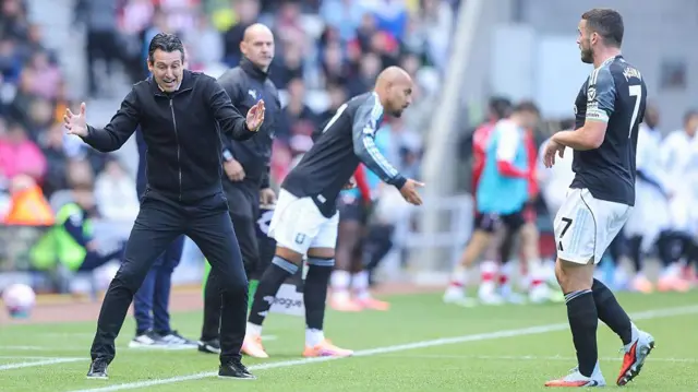 Aston Villa manager Unai Emery speaks to captain John McGinn