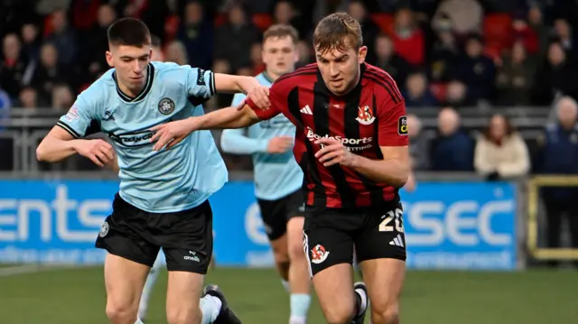 Daniel Larmour in action in the north Belfast derby