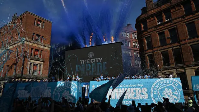 The Manchester City buses at the start of the parade