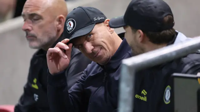 Gerhard Struber tips his baseball cap in the Bristol City dugout