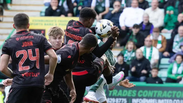 The ball appears to strike a St Mirren hand at Easter Road