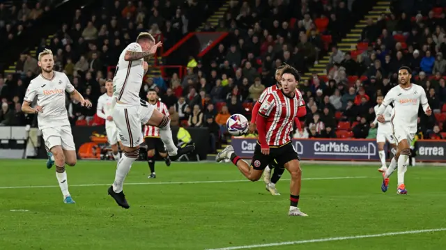 Swansea City left-back Josh Tymon scores an own goal