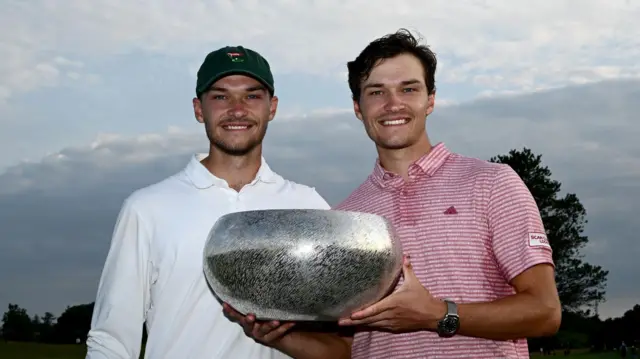Rasmus Hojgaard (right) poses with his brother Nicolai after winning the 2023  Danish Golf Championship