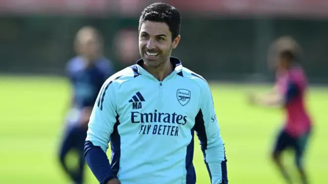 Mikel Arteta smiling in training