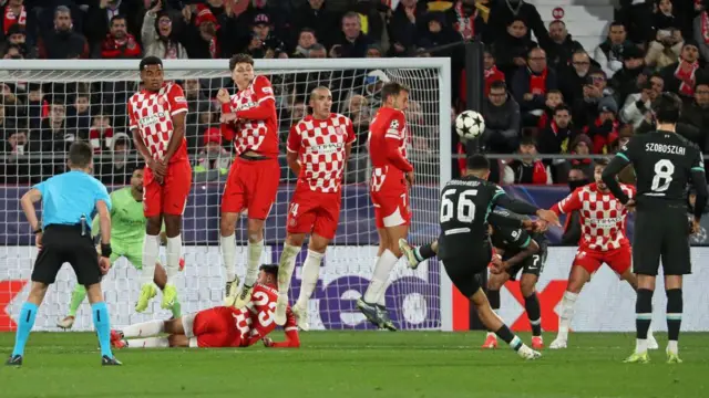 Trent Alexander-Arnold takes a free-kick