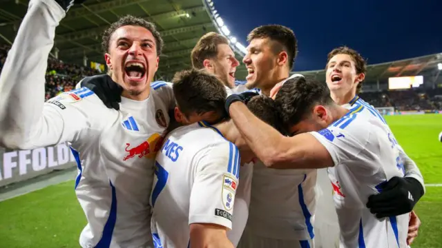 Dan James is mobbed as Leeds celebrate a goal
