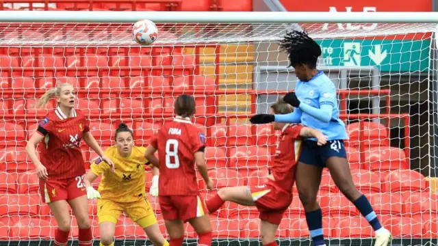 Bunny Shaw heads in the equaliser against Liverpool