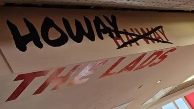 'Howay the lads' written on a ceiling/wall with 'Haway' crossed out