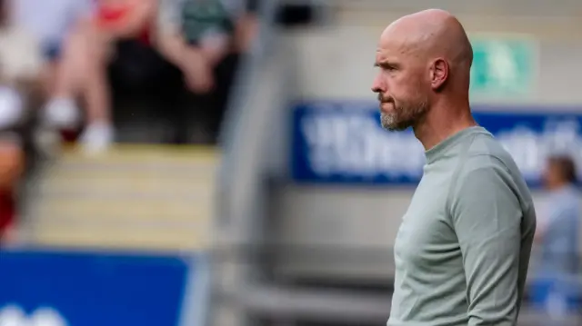 Erik ten Hag stands on the touchline