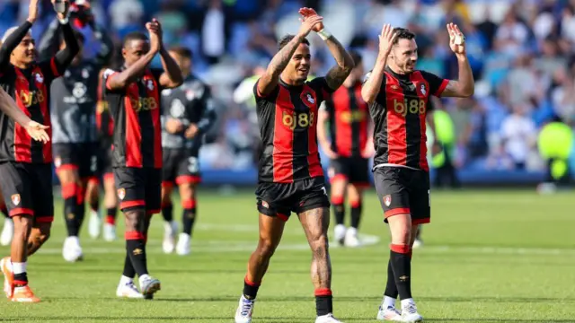 Justin Kluivert and Adam Smith of Bournemouth applaud the fans