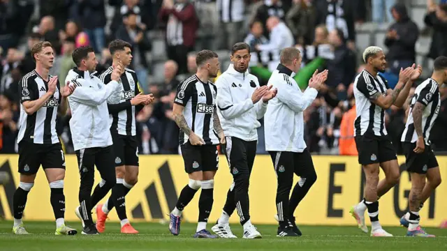 Newcastle players applaud the St James' Park crowd