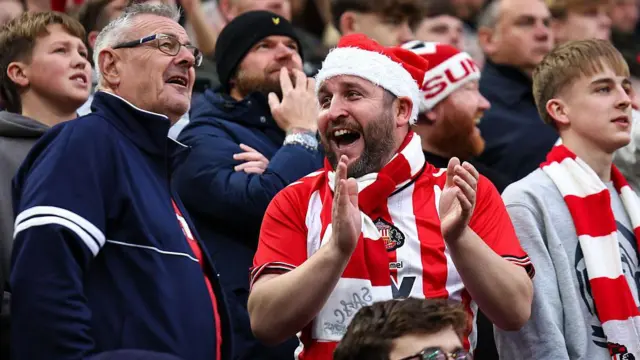A fan of Sunderland wearing a Santa hat during the Premier League match between Sunderland and Newcastle