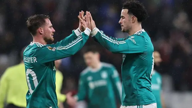 Alexis Mac Allister and Curtis Jones high-five after Liverpool's win at Sunderland