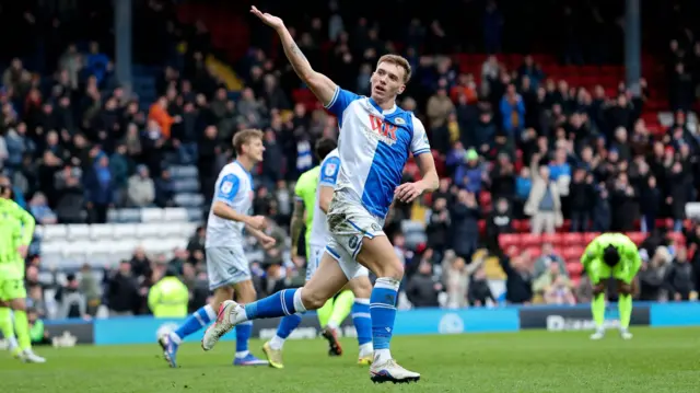 Hayden Carter celebrates with his hand aloft after scoring for Blackburn Rovers