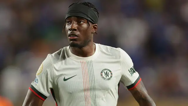 Noni Madueke looks on for Chelsea