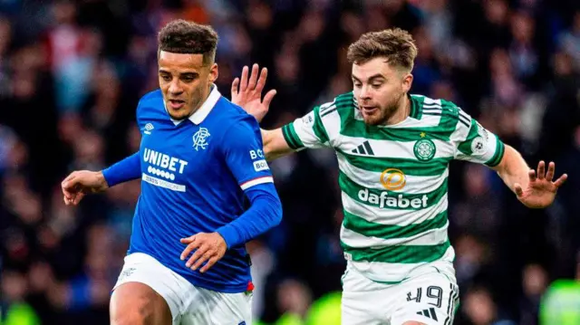 Rangers defender Max Aarons and Celtic winger James Forrest in action