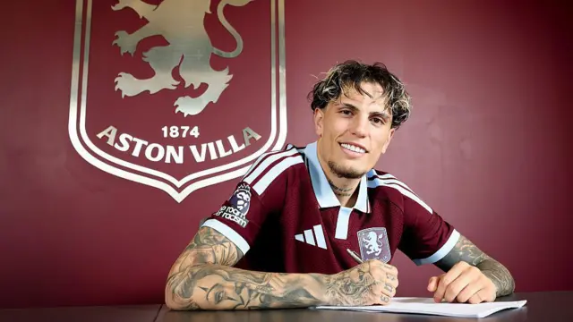 Alejandro Garnacho signing his Aston Villa contract