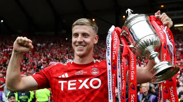 Aberdeen's Mats Knoester with the Scottish Cup trophy during the Scottish Gas Men's Scottish Cup Final between Aberdeen and Celtic at Hampden Par