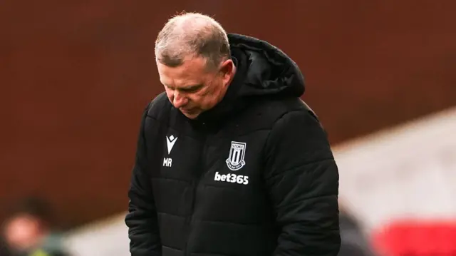 Mark Robins looking down