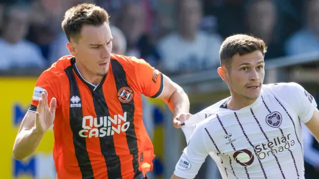 Dundee United's Ivan Dolcek and Hearts' Sabah Kerjota