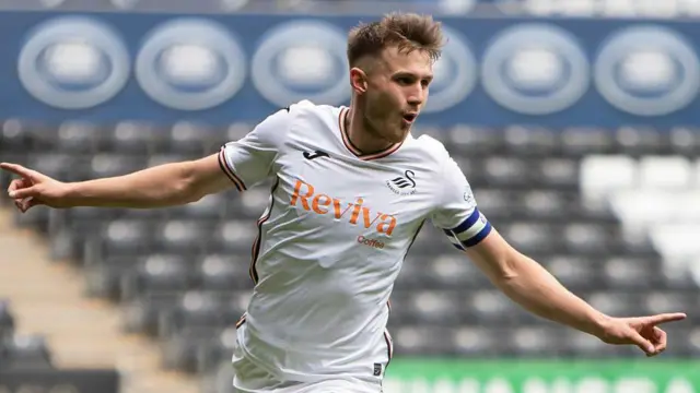 Ben Lloyd celebrates scoring for Swansea Under-21s
