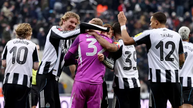 Newcastle players celebrate after winning penalty shootout