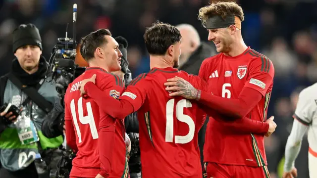 Liam Cullen celebrates with Connor Roberts and Joe Rodon 