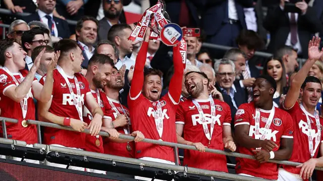 Charlton's Luke Berry lifting the League One play-off trophy