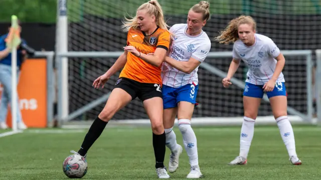 Glasgow City's Carlee Giammona (L) and Rangers' Rachel McLauchlan in action during a Scottish Women's Premier League match between Glasgow City and Rangers at Petershill Park