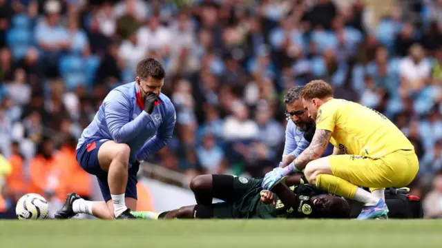 Player receives treatment for injury