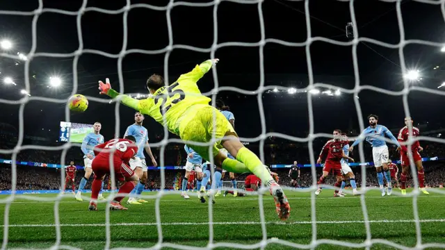 Virgil van Dijk of Liverpool scores a goal past Gianluigi Donnarumma of Manchester City