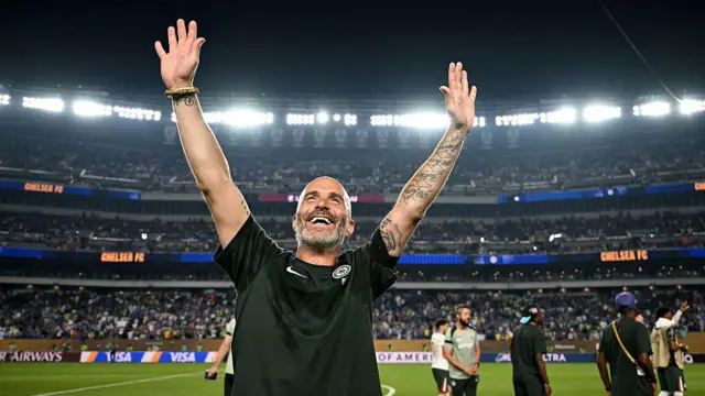 Enzo Maresca smiles at travelling fans