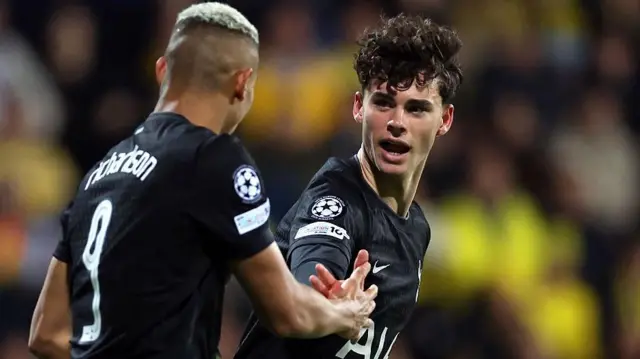 Archie Gray and Richarlison celebrate a goal for Tottenham