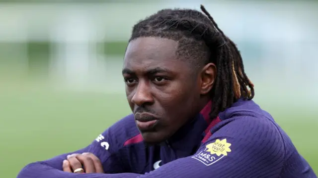 Eberechi Eze sits and stares into the distance