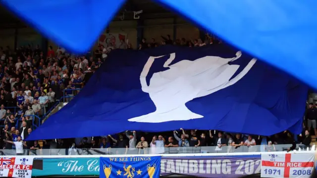 General view of Champions League trophy banner in stands at Stamford Bridge