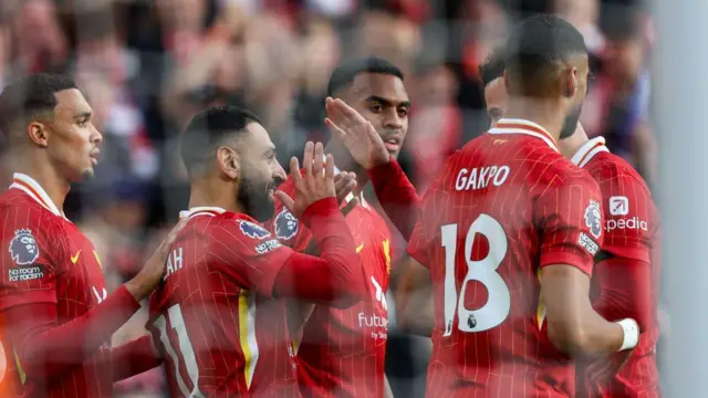 Liverpool's Mohamed Salah celebrates scoring the opening goal during the Premier League match between Liverpool FC and Chelsea FC at Anfield