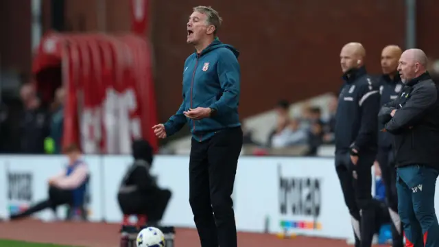 Wrexham manager Phil Parkinson shouts instructions from the sideline at Stoke
