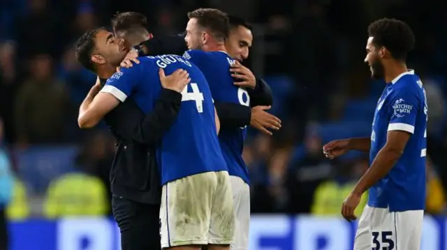 Omer Riza hugs Dimitrios Goutas after Cardiff's win over Millwall 