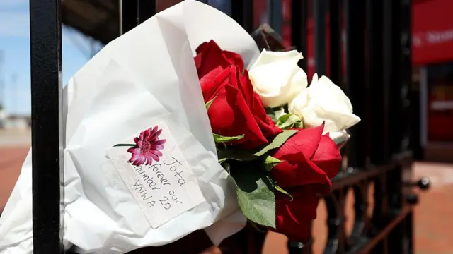 A bouquet of red and white roses