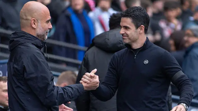 Arsenal manager Mikel Arteta and Manchester City manager Pep Guardiola greet each other