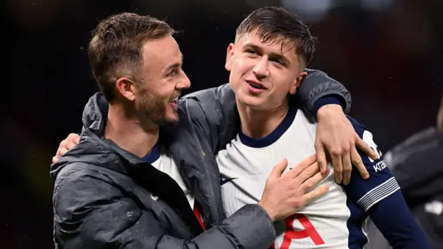 James Maddison embraces his Tottenham Hotspur team mate Mikey Moore