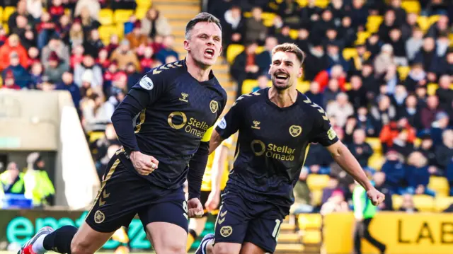 Lawrence Shankland and Claudio Braga celebrate together
