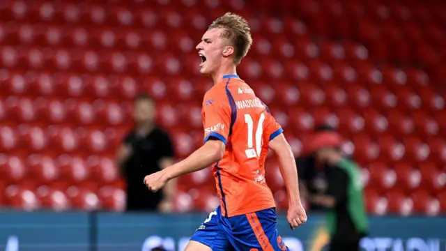 Thomas Waddingham of the Roar celebrates after scoring a goal during the round three A-League Men's match between Brisbane Roar and Sydney FC